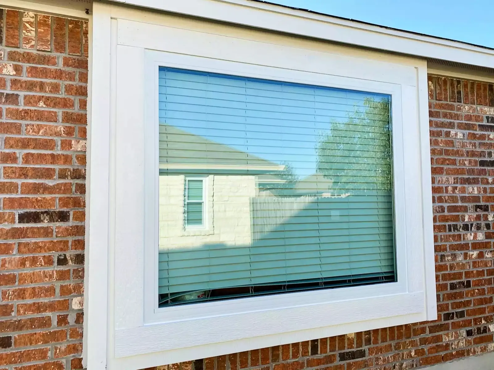 Finished window installation with clean interior trim
