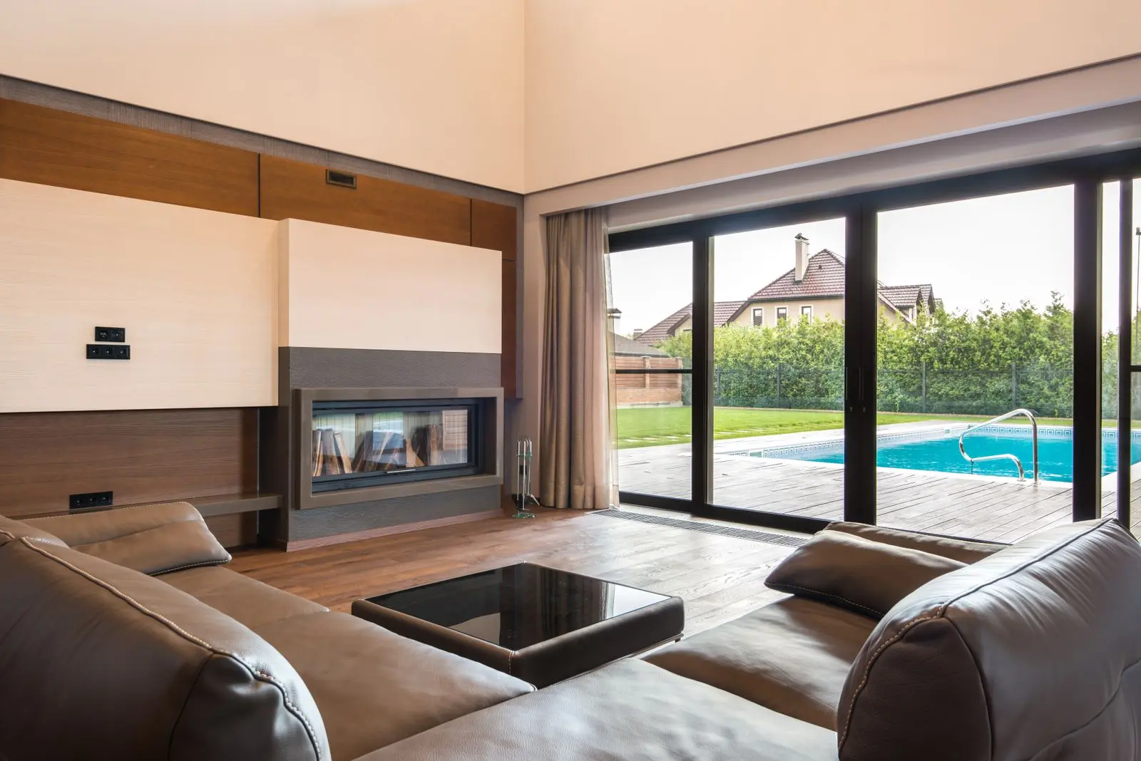 Sliding glass patio doors opening to a pool