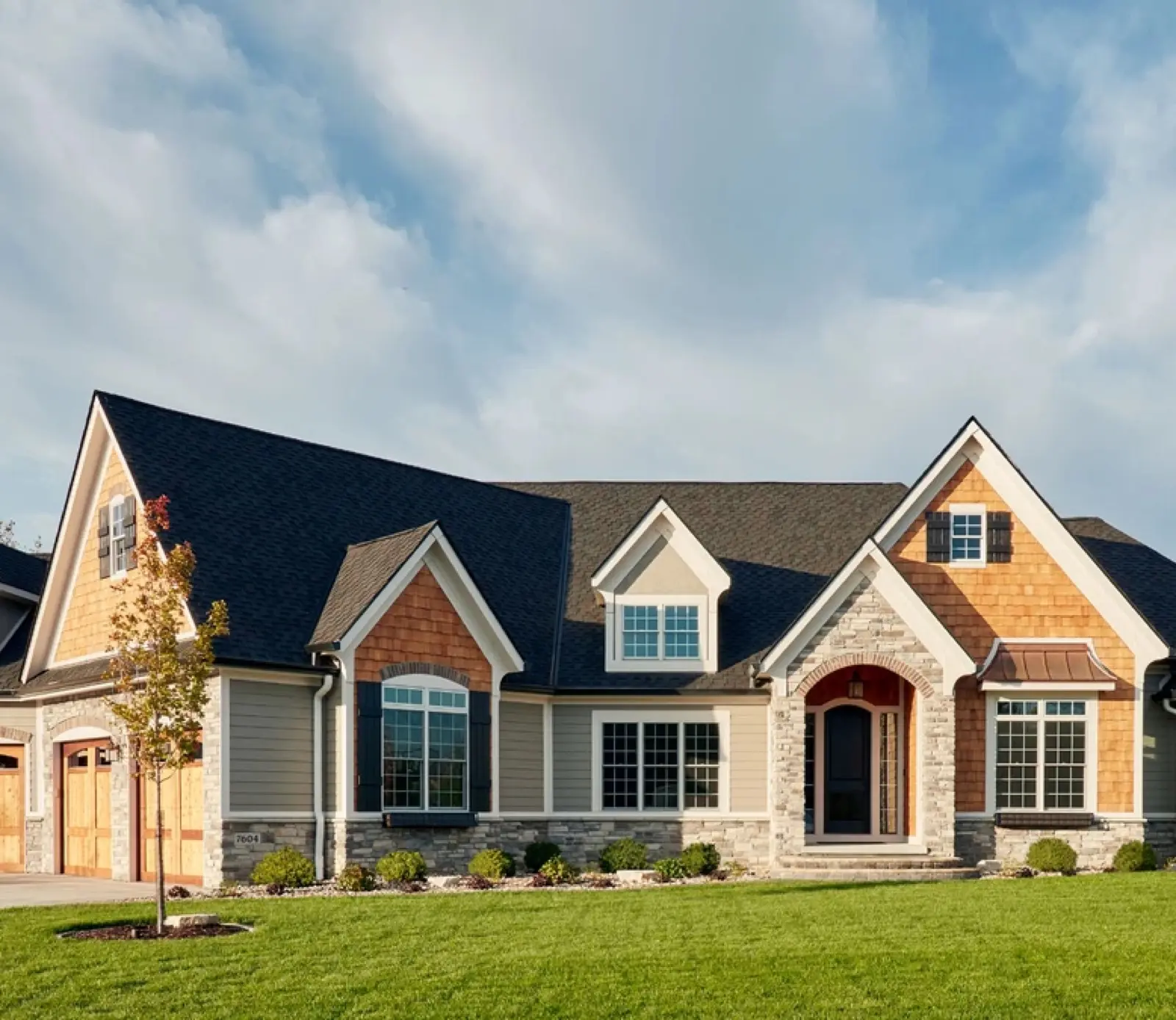 Home exterior with new double-hung windows installed by Tier One